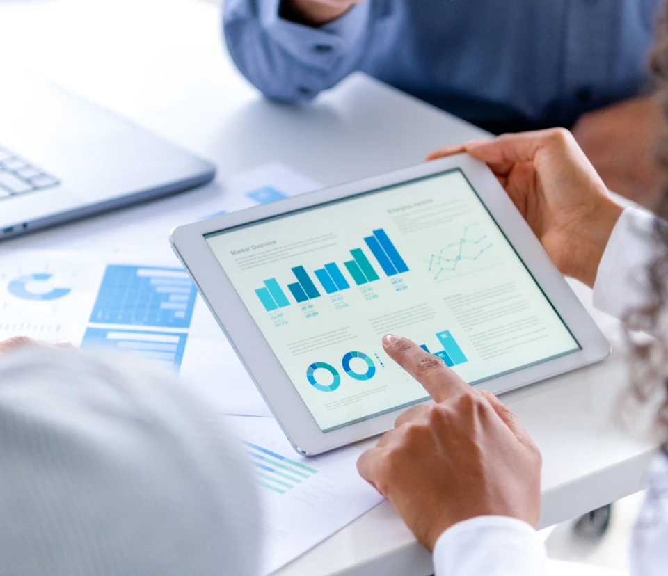 Tablet displaying business analytics and charts